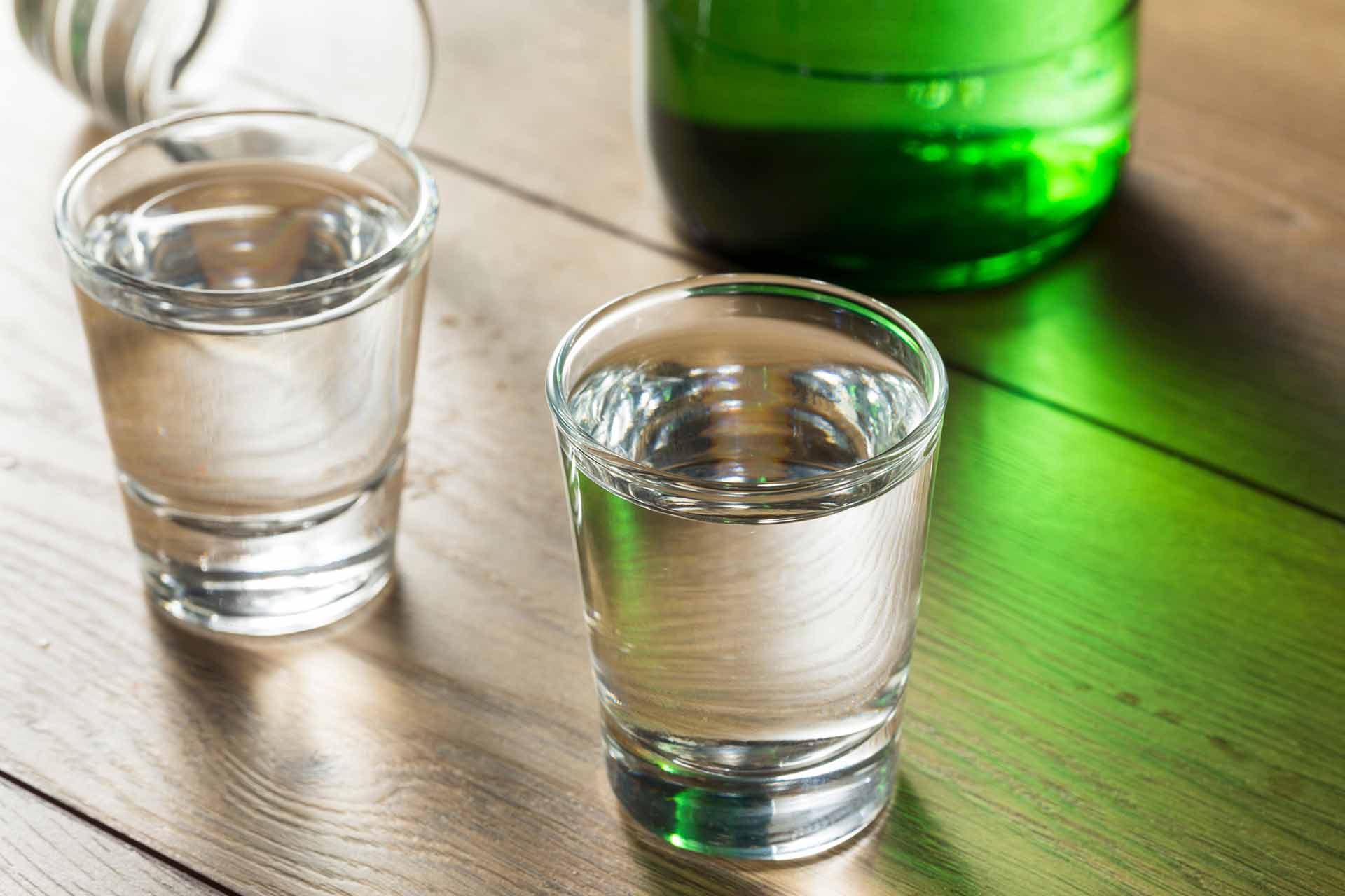 Alcoholic Clear Distilled Korean Soju in a Shot Glass / Alamy